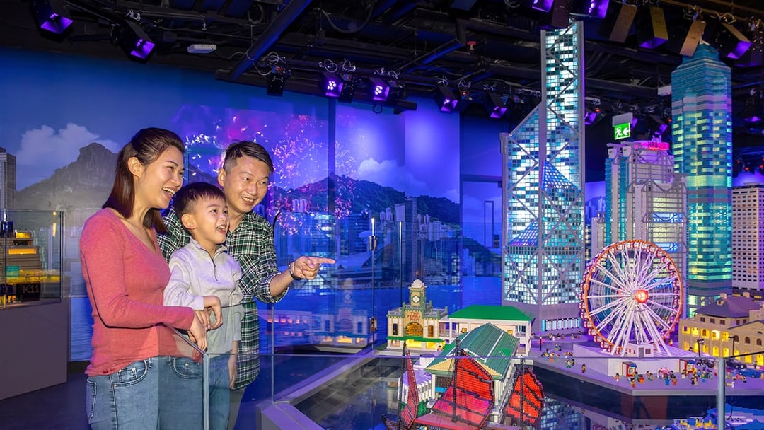 Family enjoying LEGO Hong Kong skyline display at LEGOLAND® Discovery Centre Hong Kong.