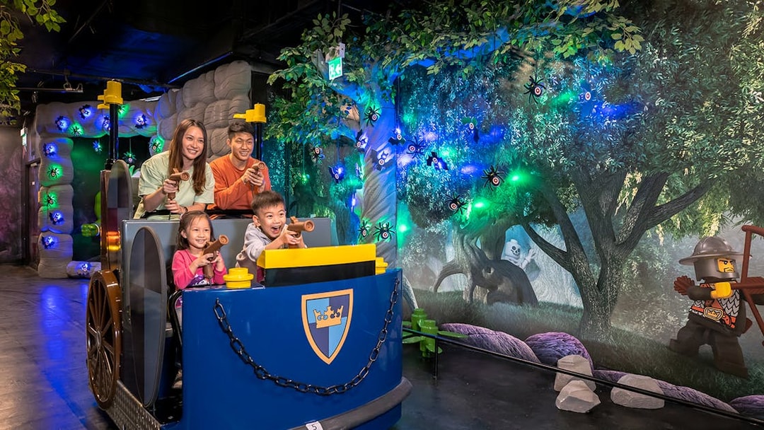 Family enjoying interactive ride at LEGOLAND® Discovery Centre Hong Kong.