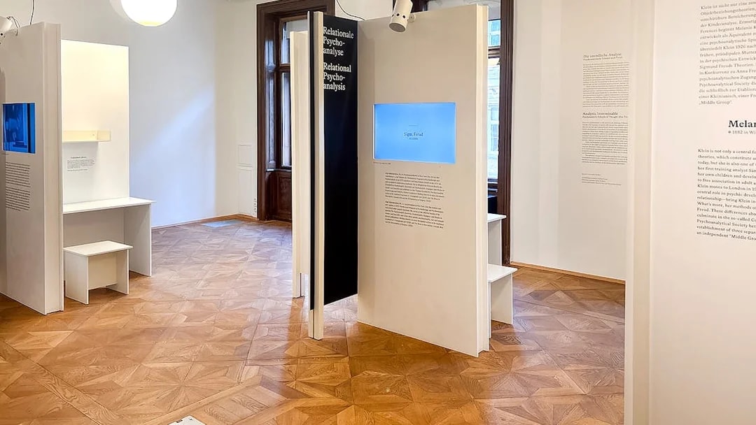 Sigmund Freud Museum exhibit room with informational panels and wooden flooring.