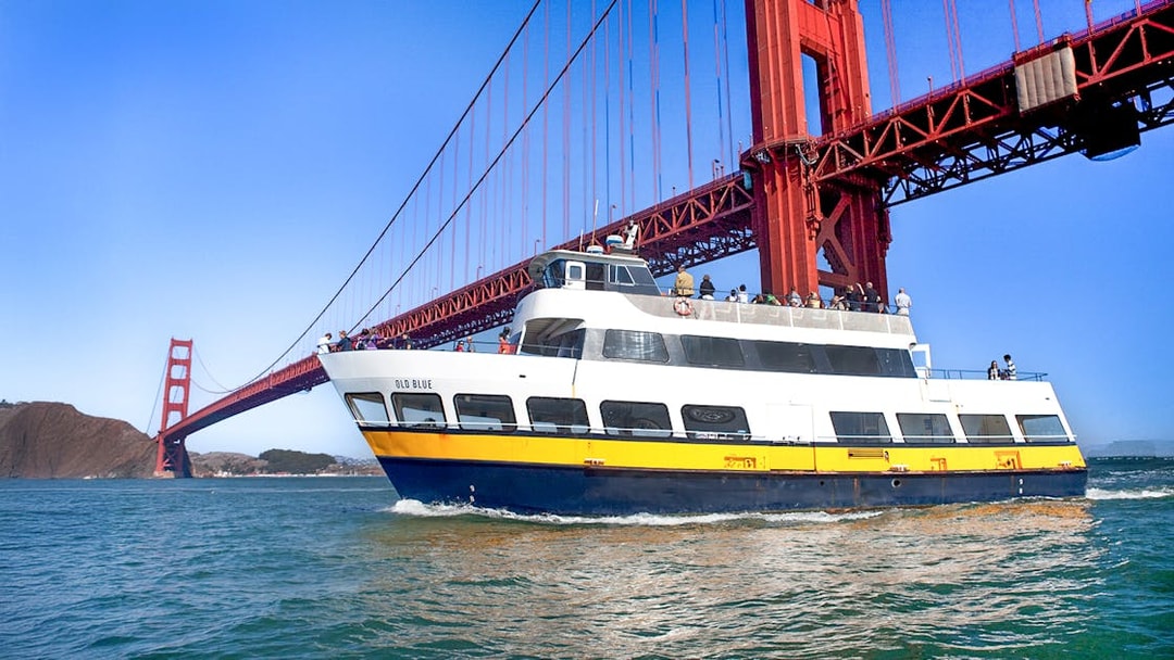 Ferry passing under the Golden Gate Bridge in San Francisco.
