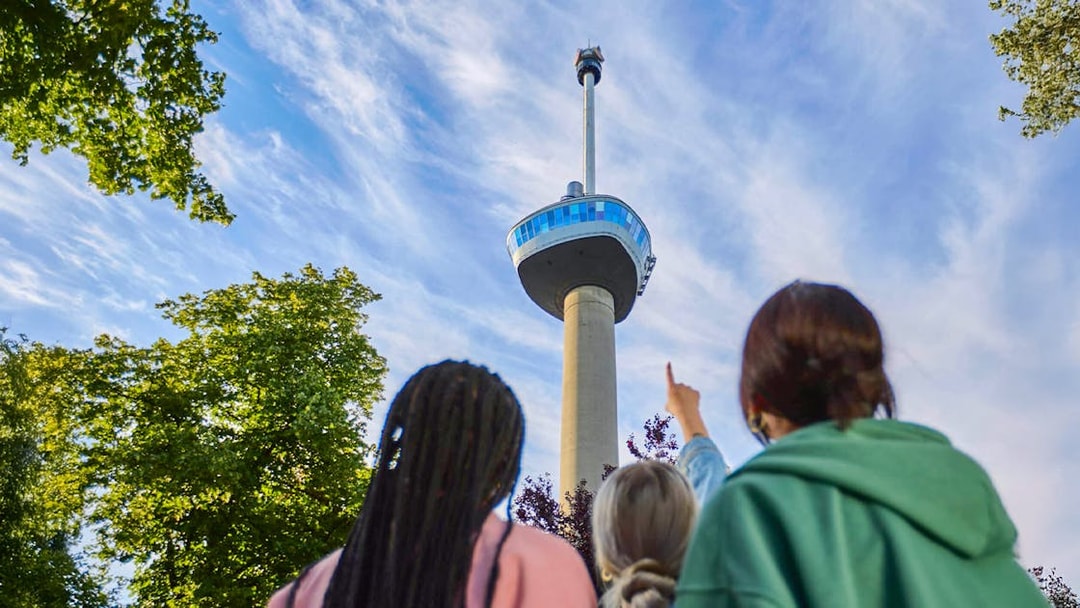 Guests looking up at the Euromast tower entrance in Rotterdam.