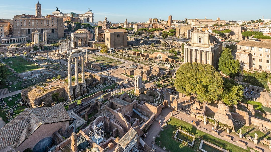 Roman Forum ruins with ancient columns and structures in Rome.
