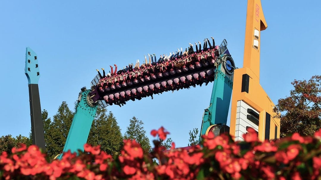 Riders upside down on a colorful thrill ride at Everland Theme Park, South Korea.