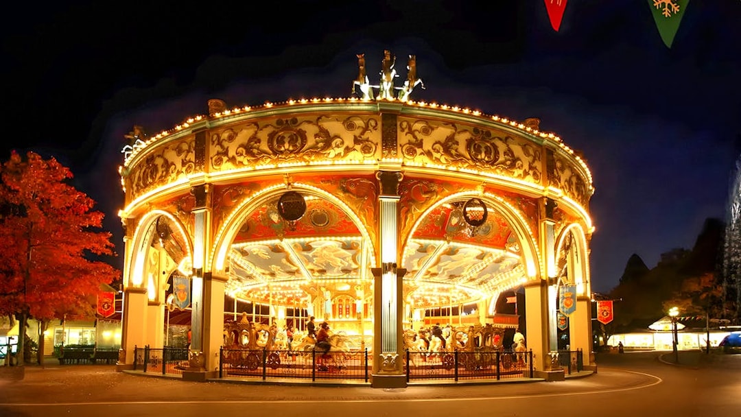 Illuminated carousel at night in Everland theme park, South Korea.