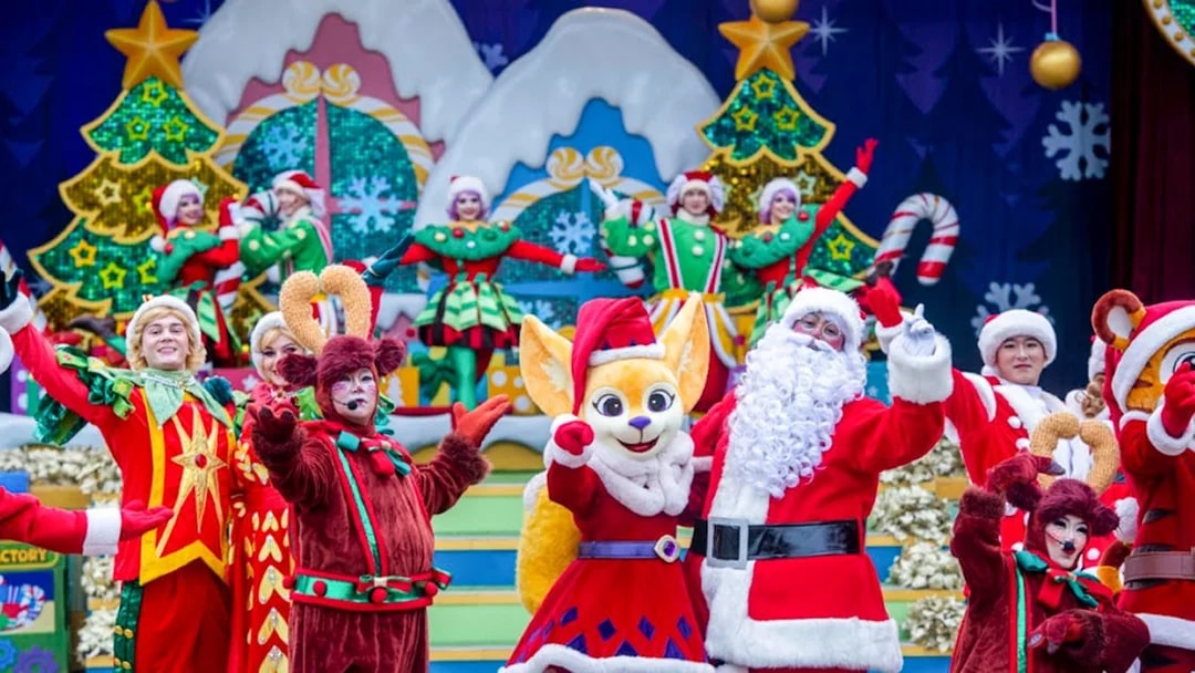 Everland Christmas performance with Santa and festive characters on stage.