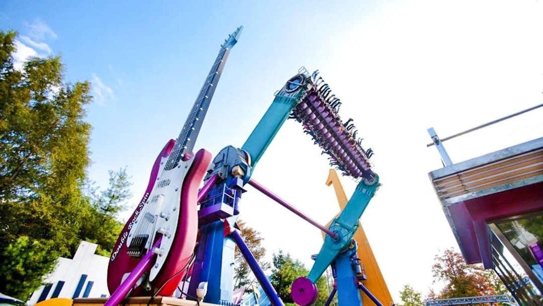 Everland Theme Park ride with giant guitar and rotating seats.