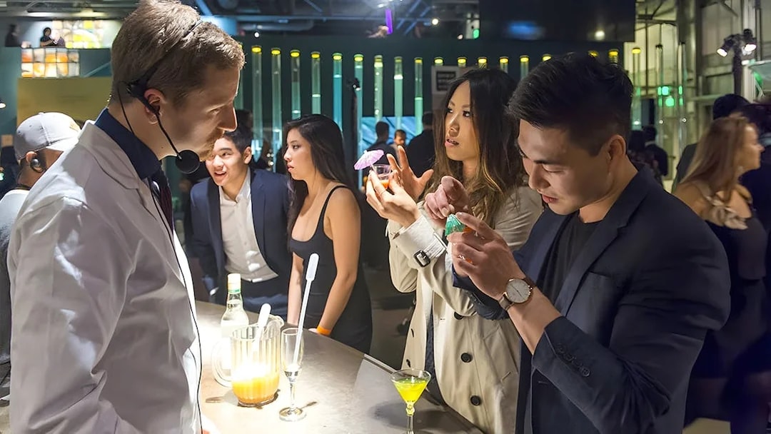 Guests interacting at a science-themed bar in the Exploratorium, San Francisco.