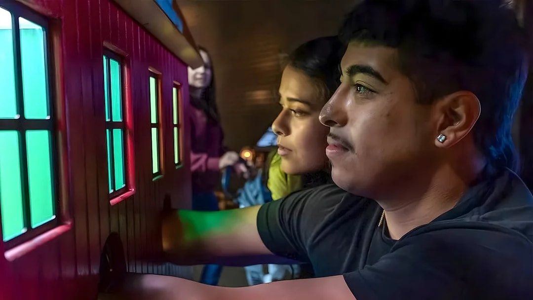 Visitors interacting with a colorful exhibit at the Exploratorium in San Francisco.