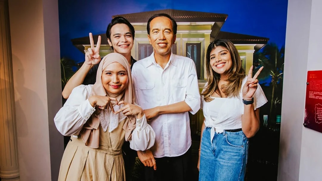 Visitors with wax figure of Joko Widodo at Madame Tussauds Singapore.