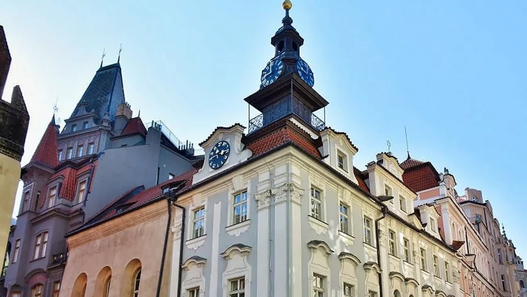 Prague Jewish Town Hall with clock tower under clear sky.