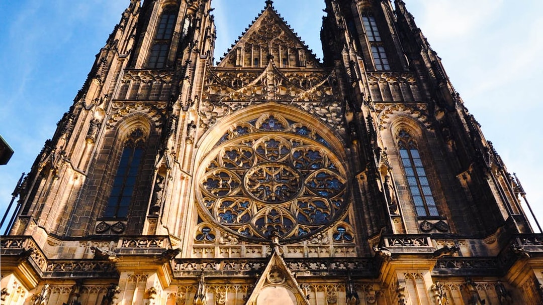 Prague Castle facade with intricate Gothic architecture details.