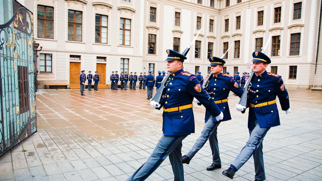 Changing of the guard ceremony at Prague Castle courtyard.