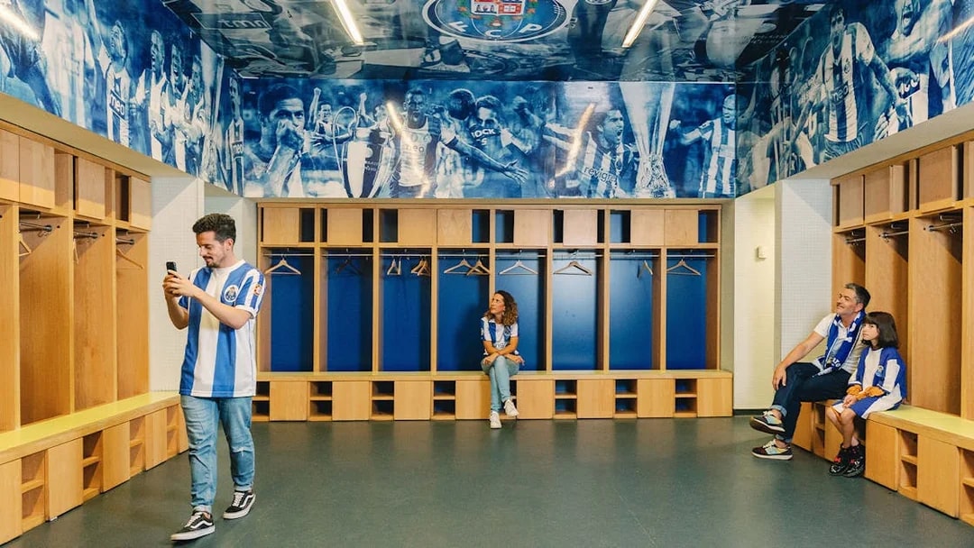 Visitors exploring FC Porto stadium museum dressing room.
