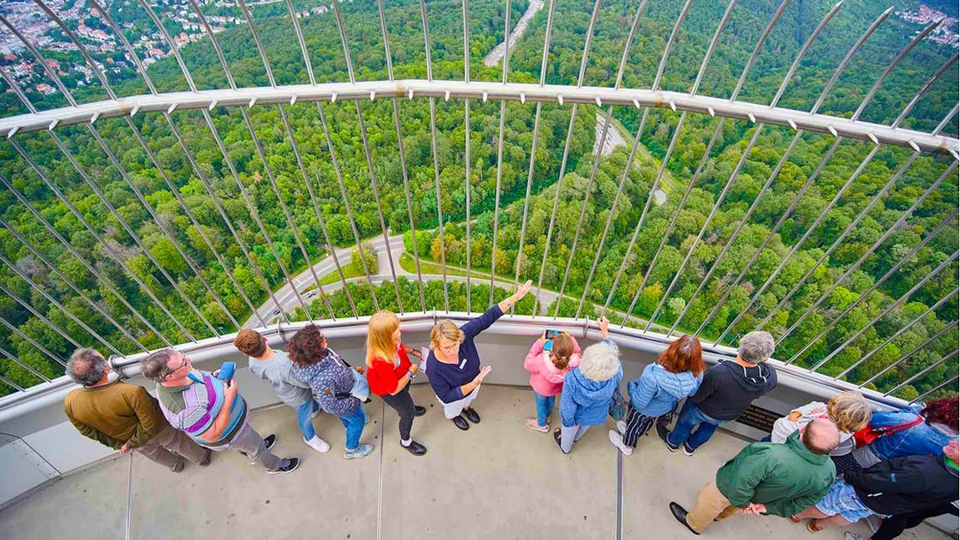 Visitors enjoying the view from the observation deck of Fernsehturm Stuttgart.