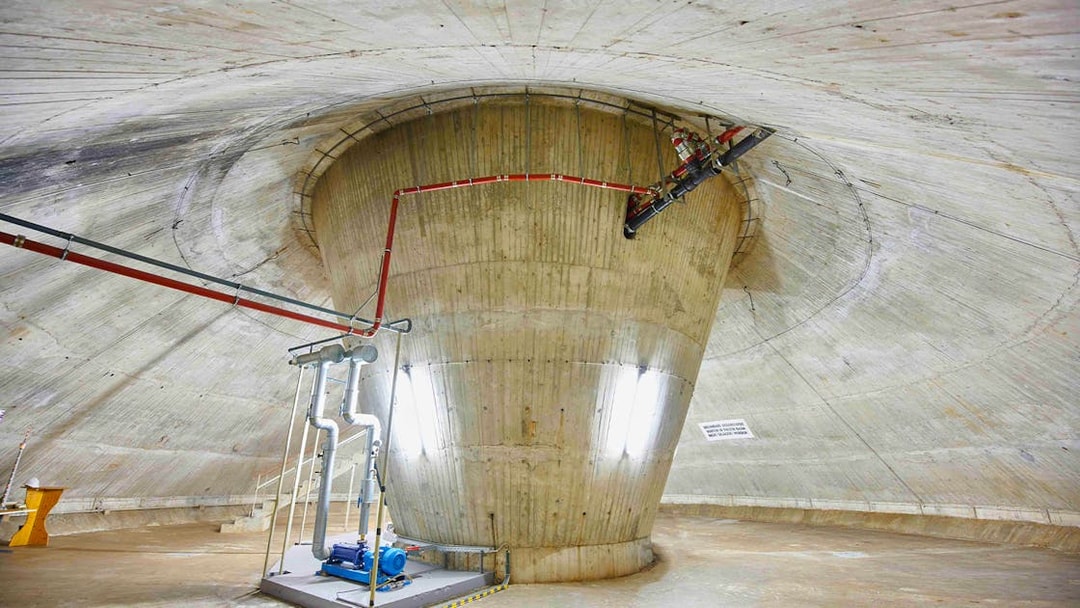 Interior view of the Fernsehturm Stuttgart structure with visible pipes and machinery.