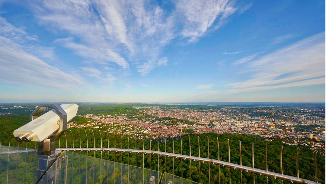View from Fernsehturm Stuttgart overlooking the city and surrounding forest.