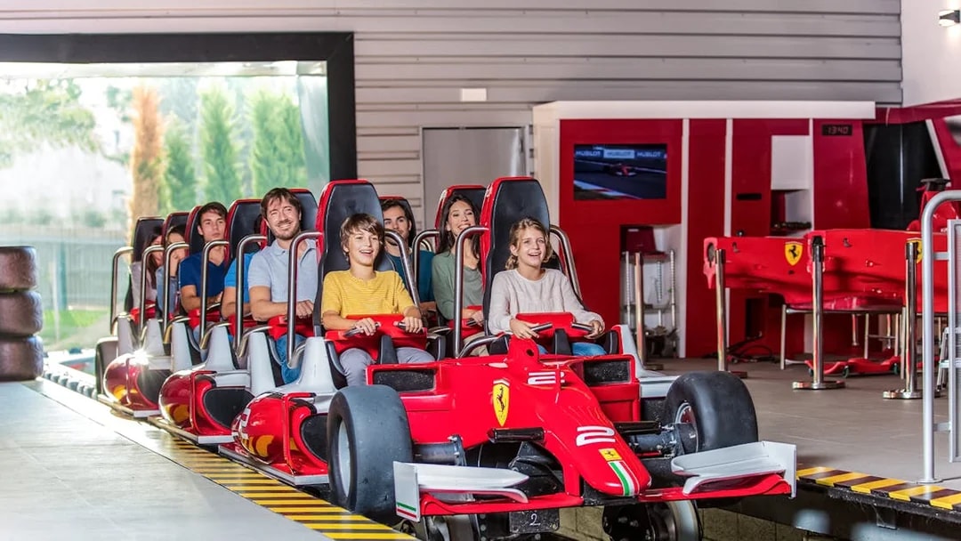 Tourists on a Ferrari-themed ride at Ferrari Land.