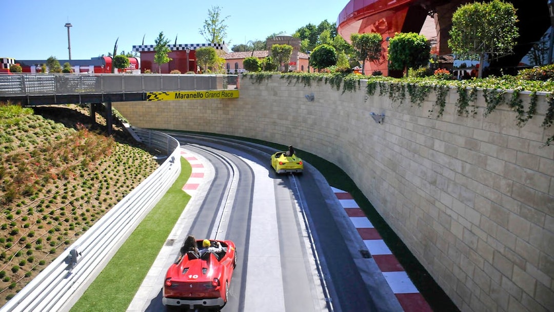 Racetrack with red and yellow cars at PortAventura World, Barcelona.