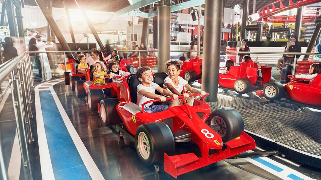 Children driving mini Ferraris at Ferrari World Abu Dhabi.