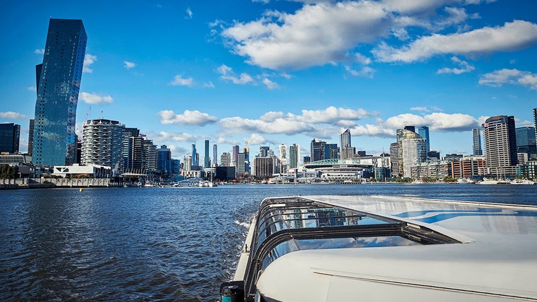 Ferry cruise on Yarra River with Melbourne skyline in the background.
