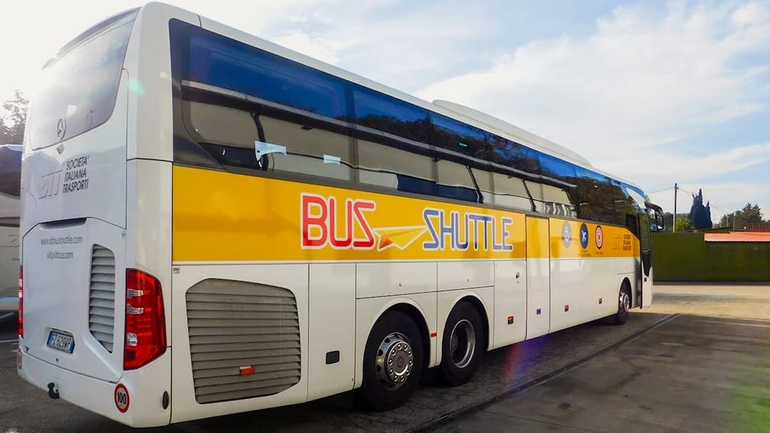 SIT Bus Shuttle parked at a station, ready for passenger boarding.