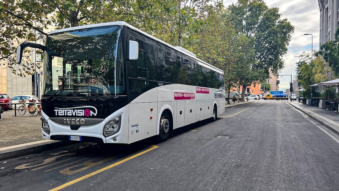 Terravision bus for Fiumicino express airport transfers parked on a city street.