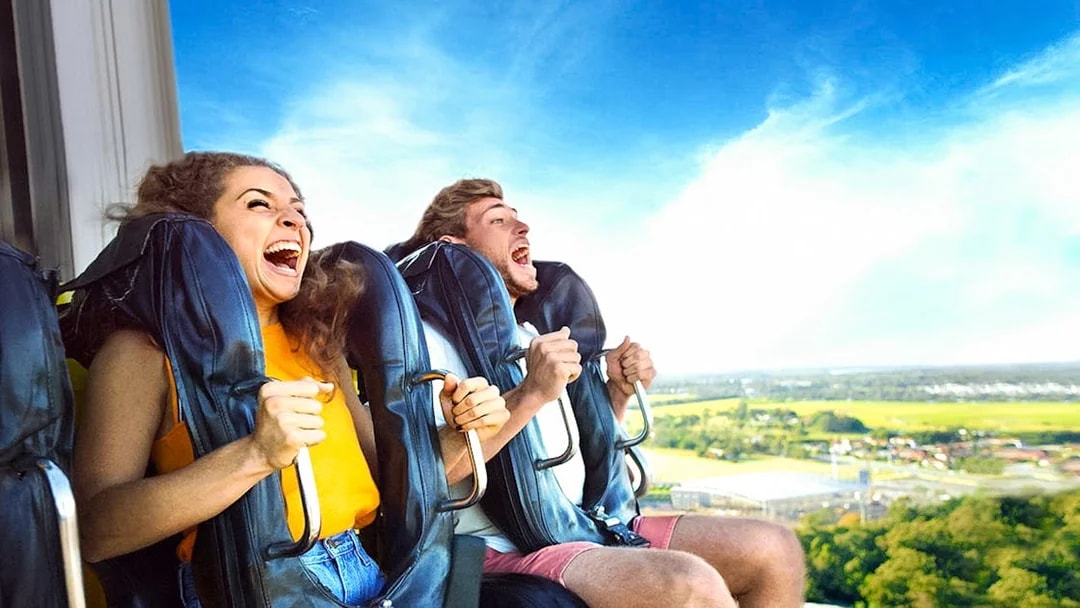 People enjoying a thrilling ride at Dreamworld amusement park.