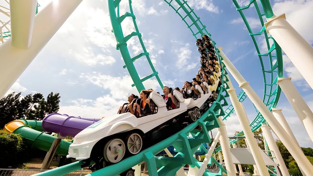 Guests riding a rollercoaster loop at Dreamworld, Gold Coast.