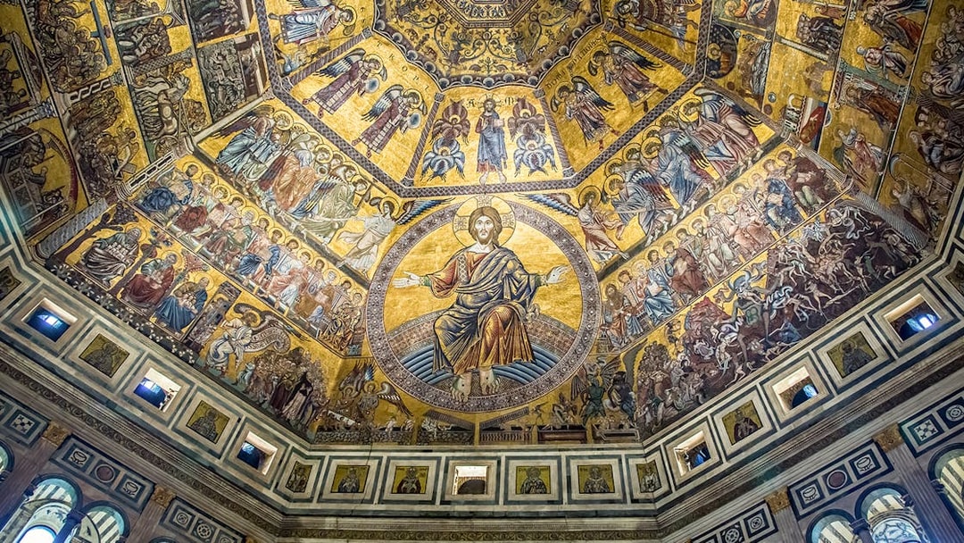 Florence Cathedral dome interior with detailed mosaics and religious figures.