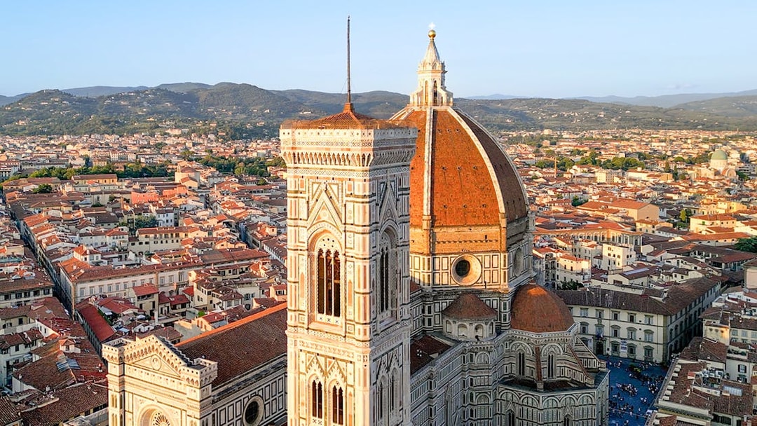 Florence Cathedral with dome and bell tower, view of cityscape.