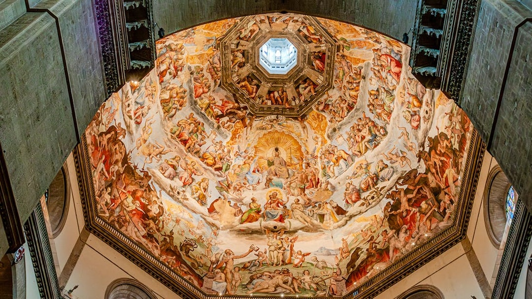 Frescoes inside Florence Duomo's dome during guided tour with cupola climb.