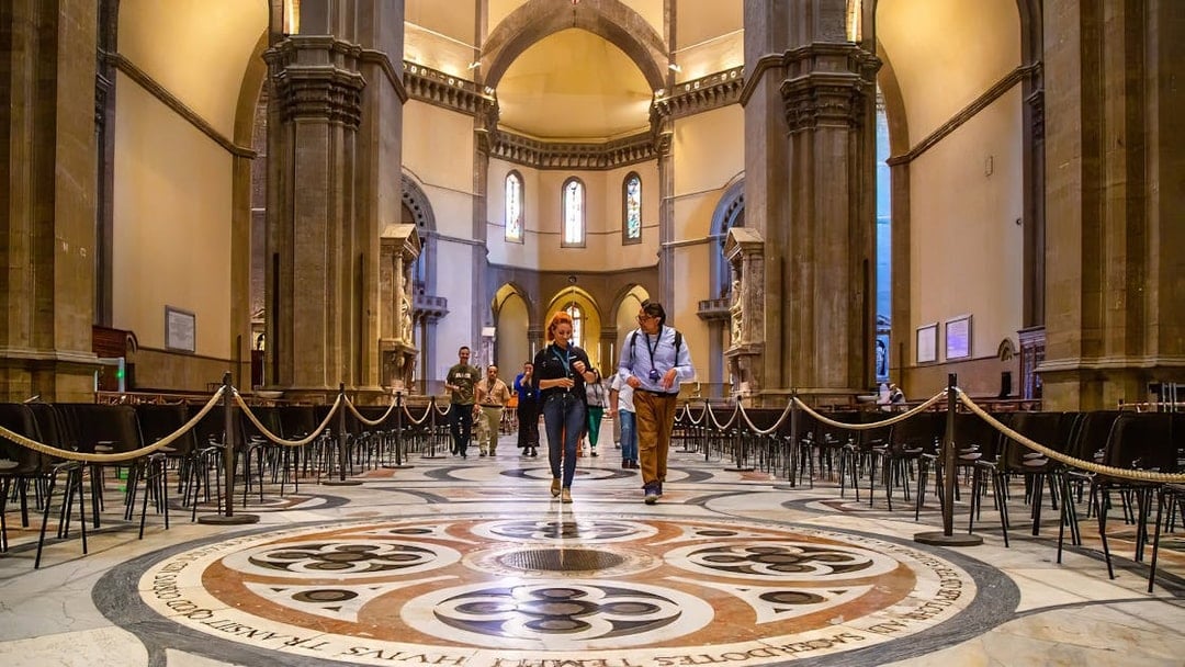 Visitors exploring the interior of Florence Duomo on a guided tour.