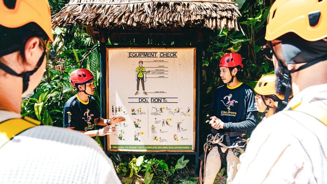 Participants receiving safety instructions for Flying Hanuman zipline tour in Phuket.