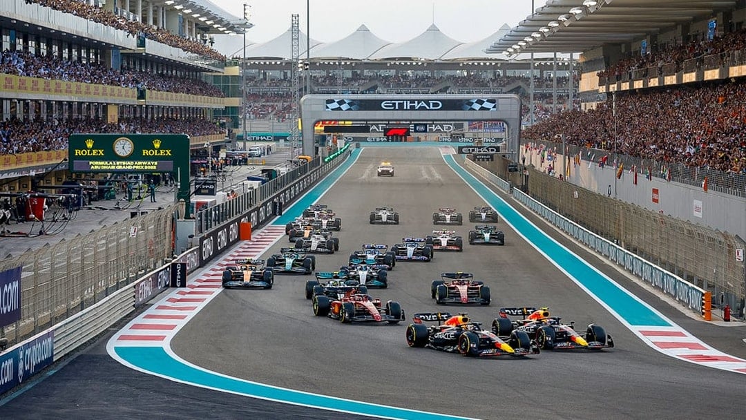 Formula 1 cars racing at the Abu Dhabi Grand Prix, Yas Marina Circuit.