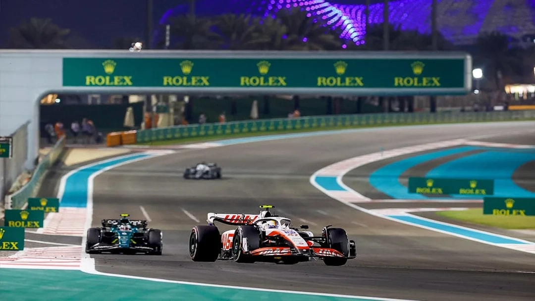 Race cars on track at Formula 1 Abu Dhabi Grand Prix, Yas Marina Circuit.