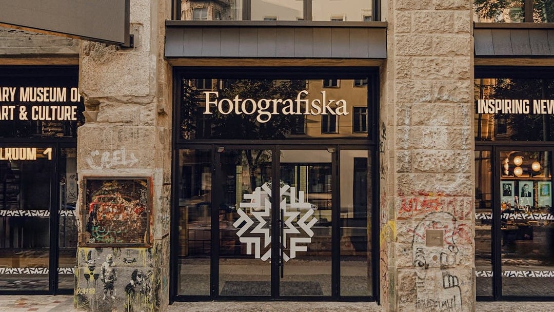 Entrance to Fotografiska Berlin with street art on the facade.