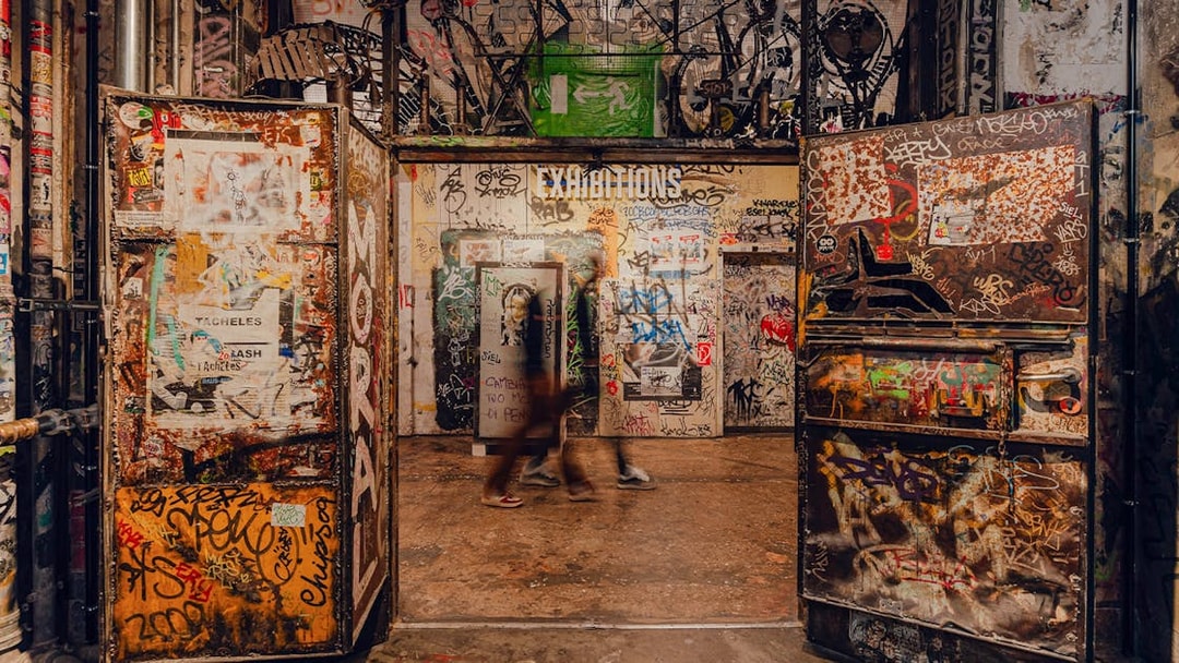 Graffiti-covered entrance to an exhibition at Fotografiska Berlin.