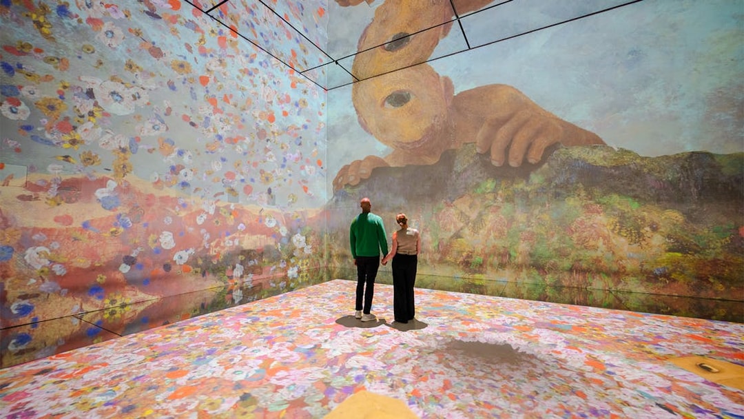Visitors exploring immersive art installation at Frameless London.