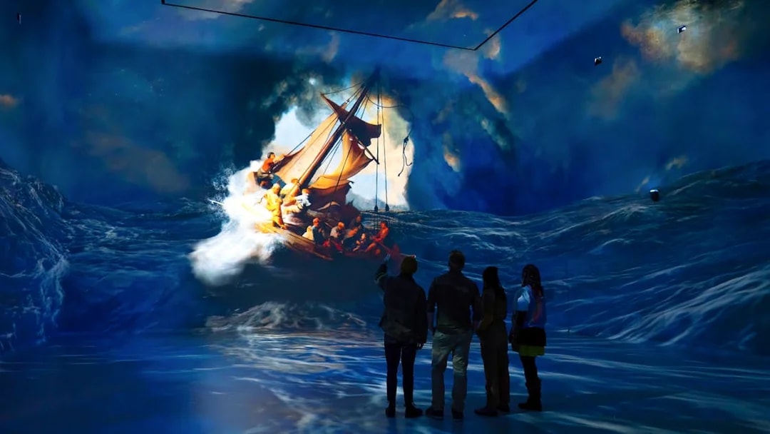 Visitors viewing immersive ocean art installation at Frameless London.