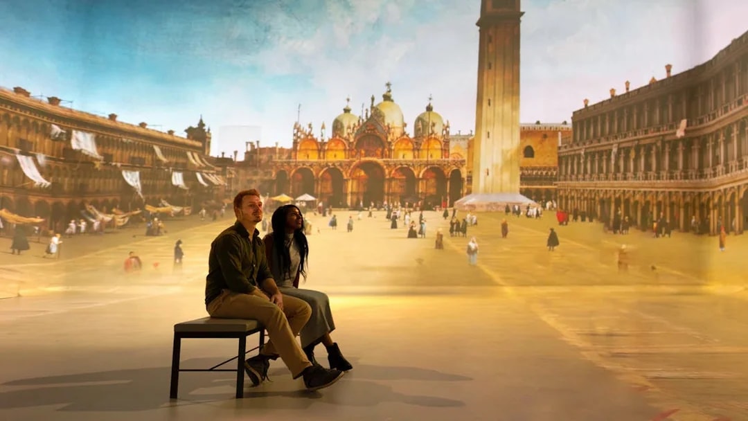 Tourists viewing a gallery exhibit featuring a historical cityscape.