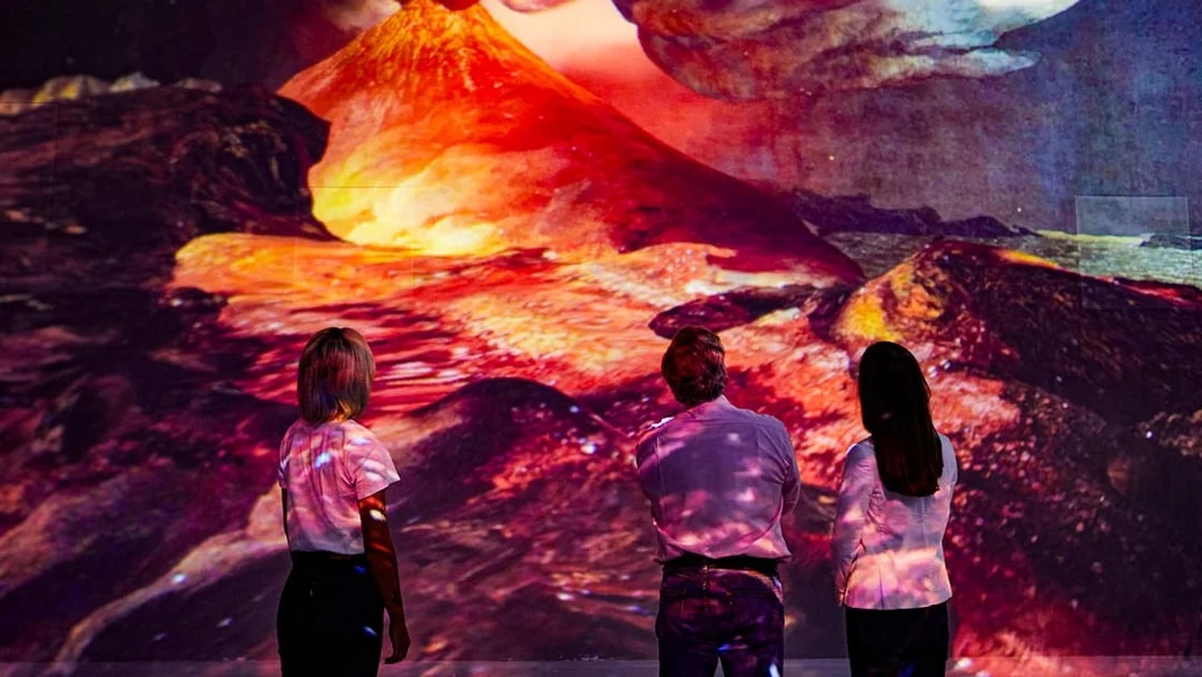Visitors viewing Vesuvius eruption at Frameless Immersive experience.