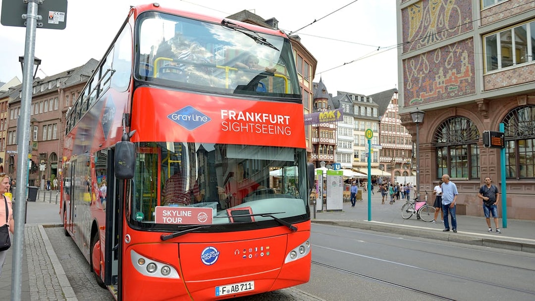 Frankfurt sightseeing bus for Skyline Hop-On Hop-Off tour on city street.