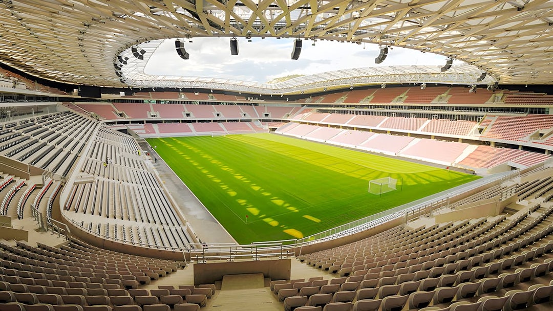 Stadium interior with empty seats and green field in the French Riviera.
