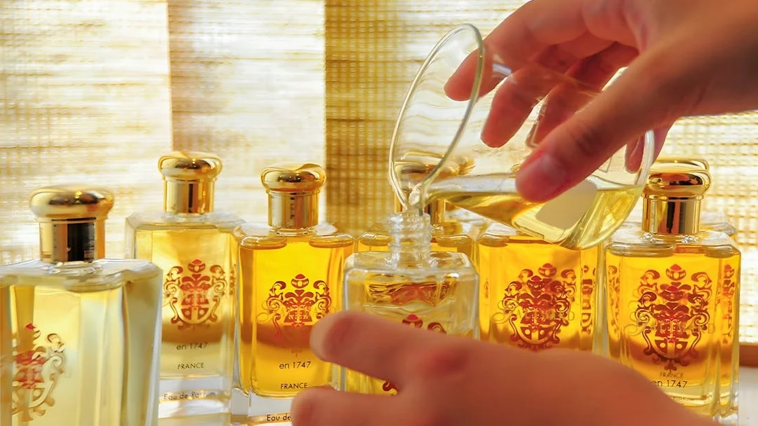 Perfume bottles being filled, showcasing French Riviera fragrance experience.