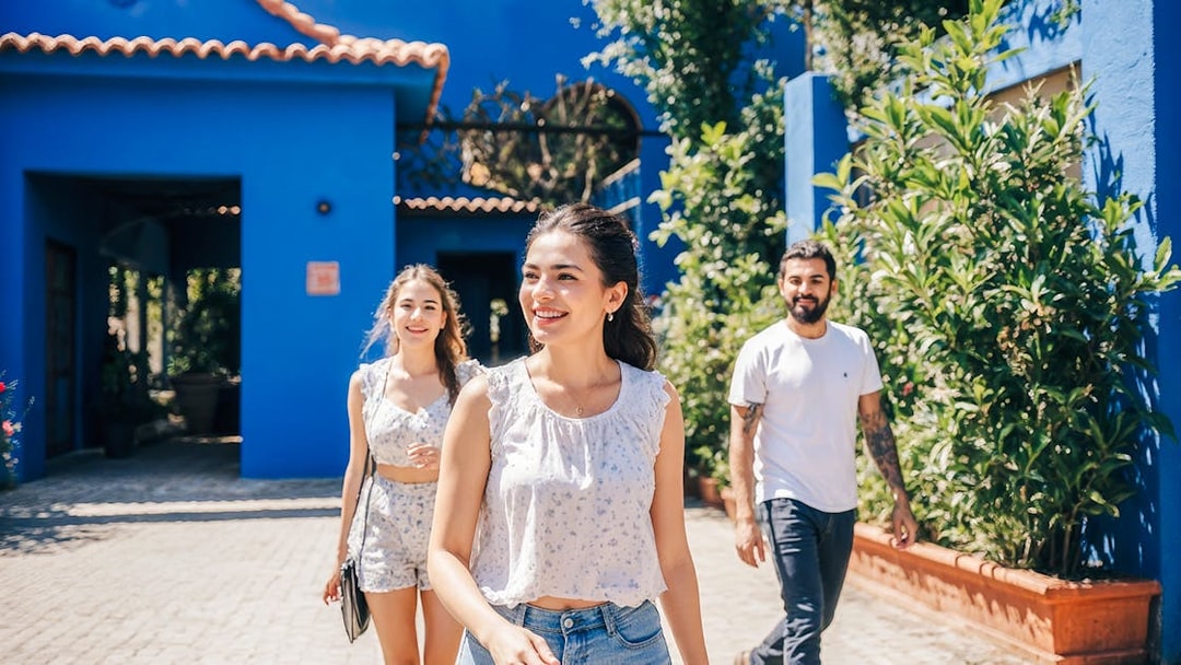 Tourists walking in the courtyard of Frida Kahlo Museum, Mexico City.