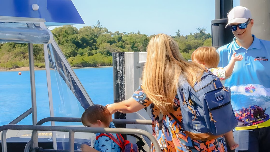 People boarding a boat for Airlie Beach Glass Bottom Boat tour.