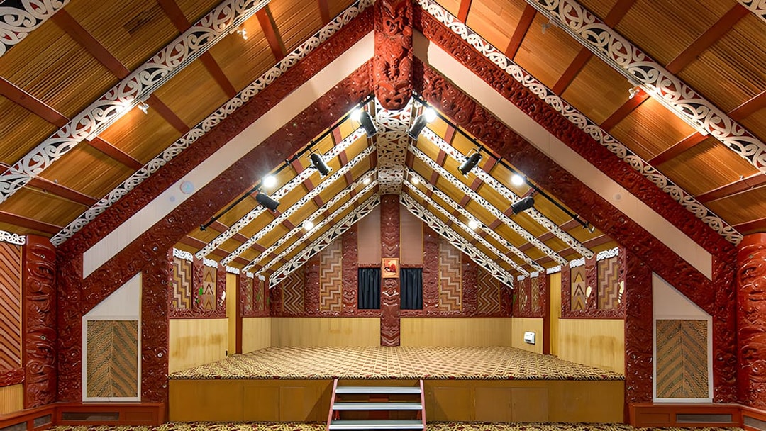 Traditional Māori meeting house interior at Te Puia, Rotorua, New Zealand.