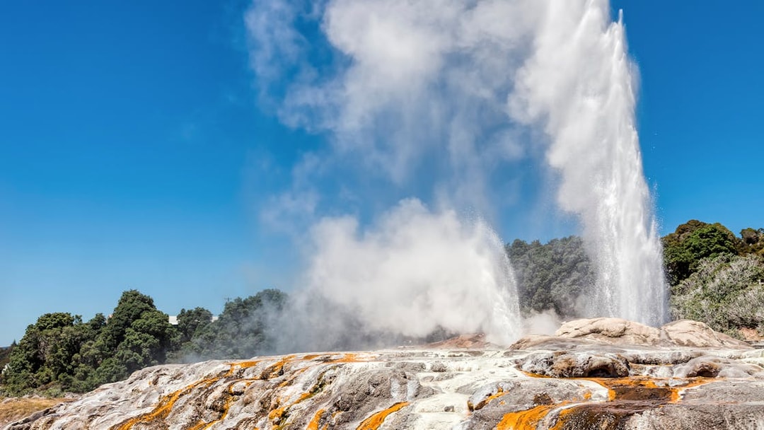 Geyser eruption at Te Puia cultural site, Rotorua, with geothermal activity, small group tour from Auckland.