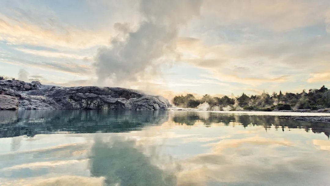 Geothermal steam rising from Te Puia's Pohutu Geyser in Rotorua, New Zealand.