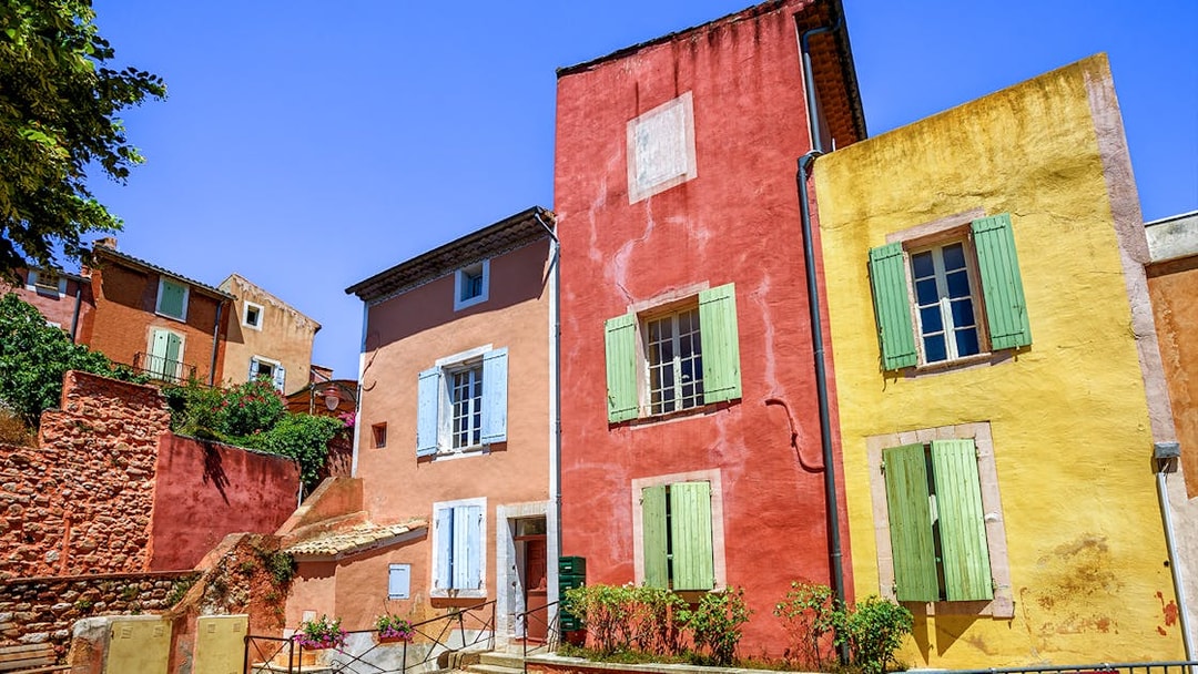 Colorful buildings in Roussillon, Provence, seen on a full-day guided tour from Avignon.